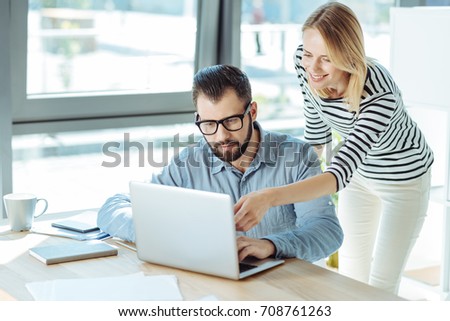 Pleasant woman giving advice to her male colleague