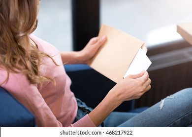 Pleasant Woman Opening The Letter