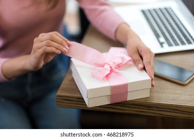 Pleasant Woman Opening Present.