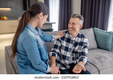 Pleasantly Surprised Man Looking At His Wife