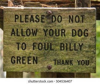 "Please Do Not Allow Your Dog To Foul Billy Green, Thank You" Sign in Skaigh Wood near the Rural Village of Sticklepath within Dartmoor National Park in Devon, England, UK