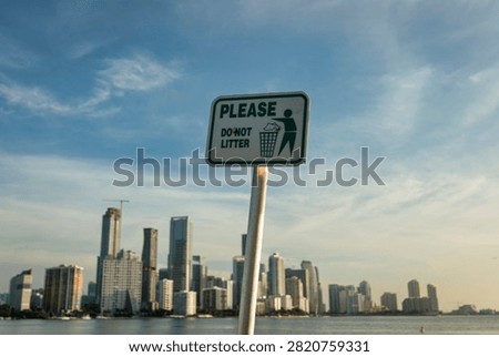 Please do not litter sign with Miami skyline