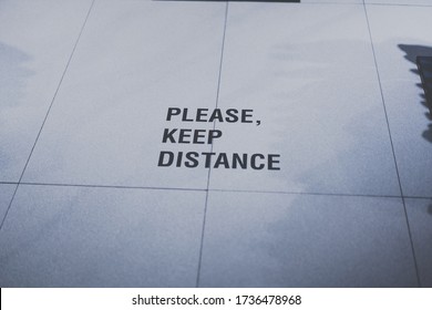 Please Keep Distance Word On The Floor.Social Distancing 6 Feet Instruction Against The Spread.New Normal Reopen Mall, School, Office.Social Distancing In The Workplace During Coronavirus (COVID-19)