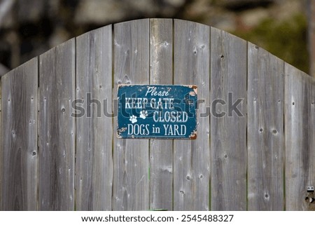 Please Keep Gate Closed Dogs in Yard display panel on a Gate. Beware of Dogs 
