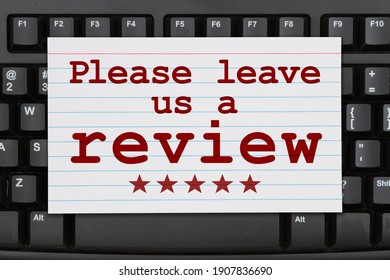 Please Leave A Review Message On A Index Card On A Black Keyboard 