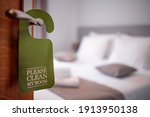 Please make up my room. Maid cleaning the room with please make up my room sign on the door. Opened door of hotel room in morning.Hotel, door open. Clean and elegant accommodation service. 