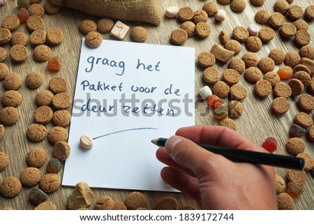Please put the presents in front of the door written in the Dutch language on a paper between ginger nuts.                            