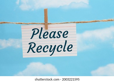 Please Recycle Message On A White Index Card Over Sky