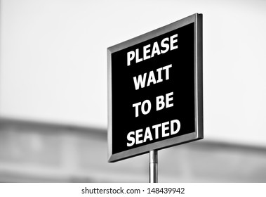 Please Wait To Be Seated Sign