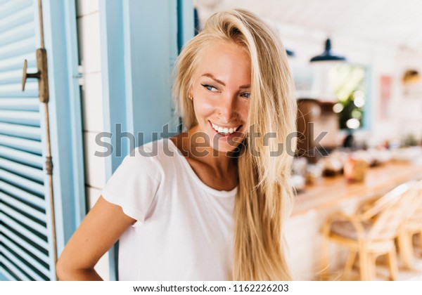 Pleased Blueeyed Woman Playfully Looking Away Stock Photo Edit