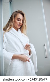 Pleased Cute Woman Getting Dressed In The Bathroom