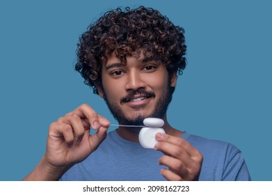 Pleased Guy Posing For The Camera Before The Flossing Procedure