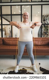 Pleased Lady Performing An Upper Body Exercise