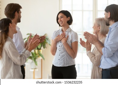 Pleased Proud Asian Young Businesswoman Get Multiethnic Team Appreciation Support Applause, Happy Diverse Business People Group Applauding Praising Korean Female Worker, Employee Recognition Concept