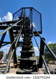 PLEASLEY, UK - MARCH 1, 2019: Headstocks, Winding Gear and visitors at Pleasley Colliery Mining Heritage Museum, Derbyshire, UK