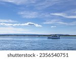 Pleasure Boat Yacht cruses along the Snohomish River Delta Port Gardner Bay in Everett Washington