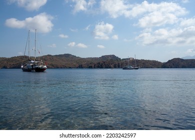 Pleasure Yacht In The Sea. Tourist Ship With People On Board With Turkish Flag Sails On The Waves. Fast Moving Excursion Ship Boat. Marmaris, Turkey - September 9, 202