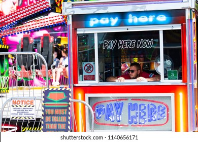 Pleasureland Southport, Merseyside, England - 15th - July - 2018 - A Ride Operator Waits To Take Tickets From Customers