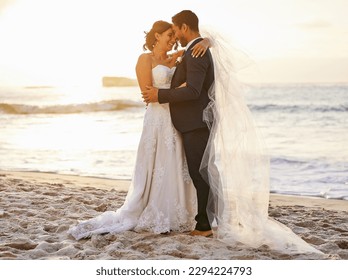 I pledge to honour you, love you and cherish you. Shot of a young couple on the beach on their wedding day. - Powered by Shutterstock