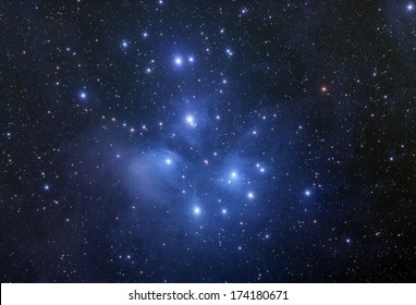 The Pleiades cluster with the surrounding nebula.