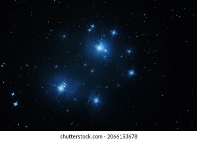 The Pleiades open star cluster in the constellation Taurus in night sky.