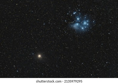 The Pleiades or Seven Sisters M45 meeting the planet mars on the night sky