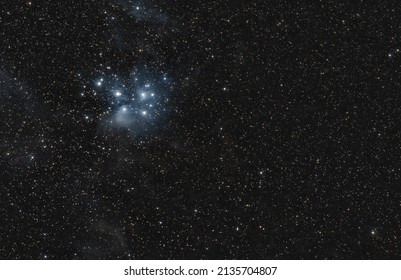 The Pleiades or Seven Sisters M45 and their reflection nebulae on the night sky