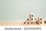 Plenty many wooden blocks full crossed marks table background. Wrong mistakes failure faults symbol icon. Defect malfunction error bug imperfection inaccuracy product manufacturing production concept.