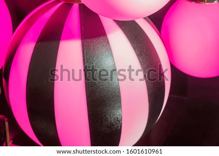 plenty pink lanterns in ball shape. Party decoration