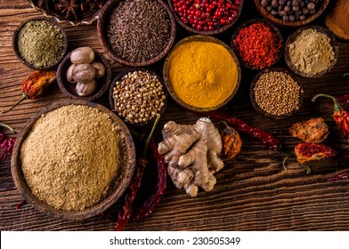 Plenty of traditional Asian spices in wooden bowls