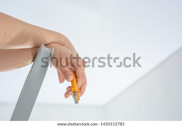 Pliers Hands Handywoman On Background Ceiling Stock Photo