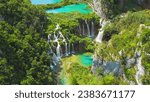 Plitvice Lakes National Park in Croatia. Summer mountain landscape with streams with emerald green water and waterfalls.