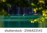 Plitvice Lakes National Park. Croatia. Big waterfalls. Nature travel background. Beautiful nature. Plitvice waterfalls in Croatia. Mountain streams flow into a lake with azure clear water.