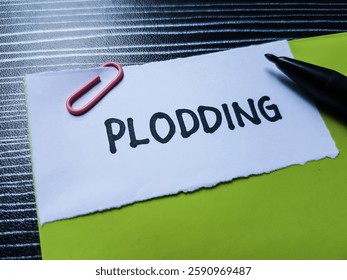 Plodding writting on table background.