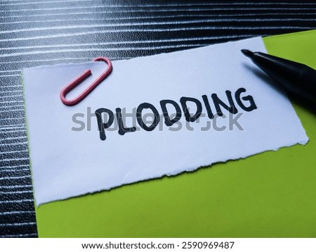 Plodding writting on table background.