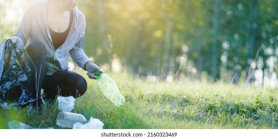 Plogging concept. Adult woman picking up garbage. Eco run. Woman jogging with garbage bag.  - Shutterstock ID 2160323469