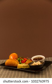 Ploughman's Lunch With Stilton Cheese, Pickle, Pickled Onion, Salad, Cole Slaw And Bread Roll And Apple. Copyspace Above.