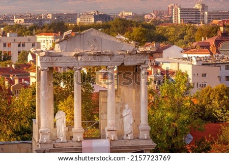 Plovdiv, Bulgaria, Statue, column and fragment of ancient roman amphitheatre, background
