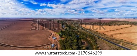 Plowed agriculture farmlands around Moree rural regional town on Artesian basin in Australia - aerial panorama.