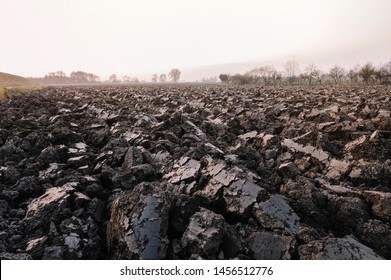 Plowed Soil. Spring Field. Sunset Over Ploughed Field. Countryside Lanscape. Vintage Polaroid Filter Applied.