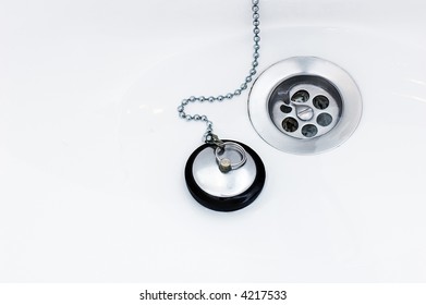 A Plug And A Discharge In The Wite Sink