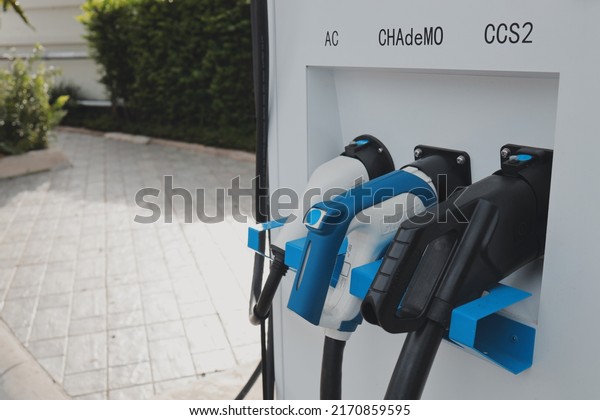 Plug EV\
charging station for electric car charging battery. Electric car\
power station with electricity charging\
battery