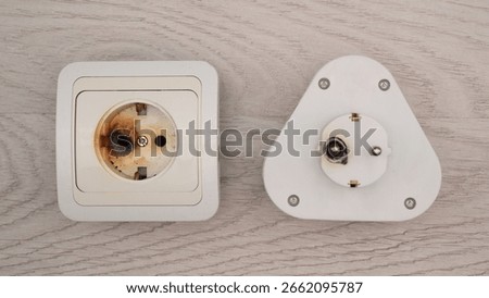 Plug and socket burned melted electrical short circuit or burnout due to poor contact