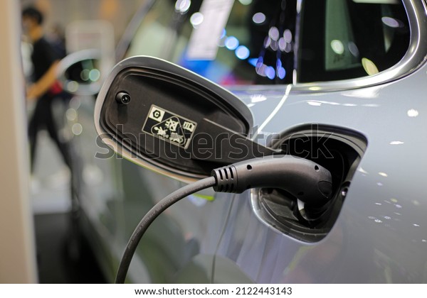 Plug socket charging Electric vehicle EV\
concept of new technology for automobile vehicles use electricity,\
typically stored in a battery, to power an electric motor. Charging\
car is time consuming.