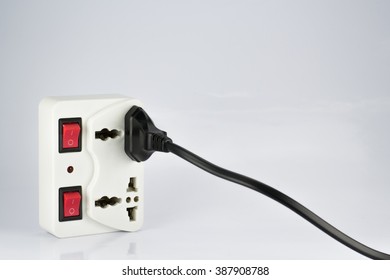 plug socket with switch on/off and plugs on white background