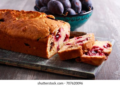 Plum And Chocolate Loaf Cake On Board