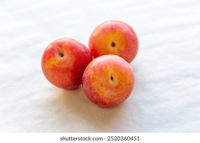 plum fresh fruit yellow on light wooden background close-up - Powered by Shutterstock