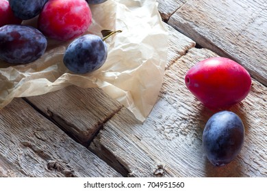 Plum fruits fresh white paper rustic wood background - Powered by Shutterstock