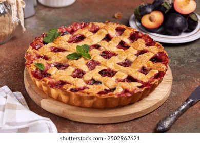 Plum pie with lattice. Delicious summer homemade American cake with plums and cinnamon. Sweet dessert  - Powered by Shutterstock