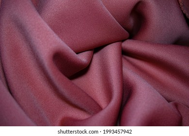 Plum red lycra fabric in soft fold.